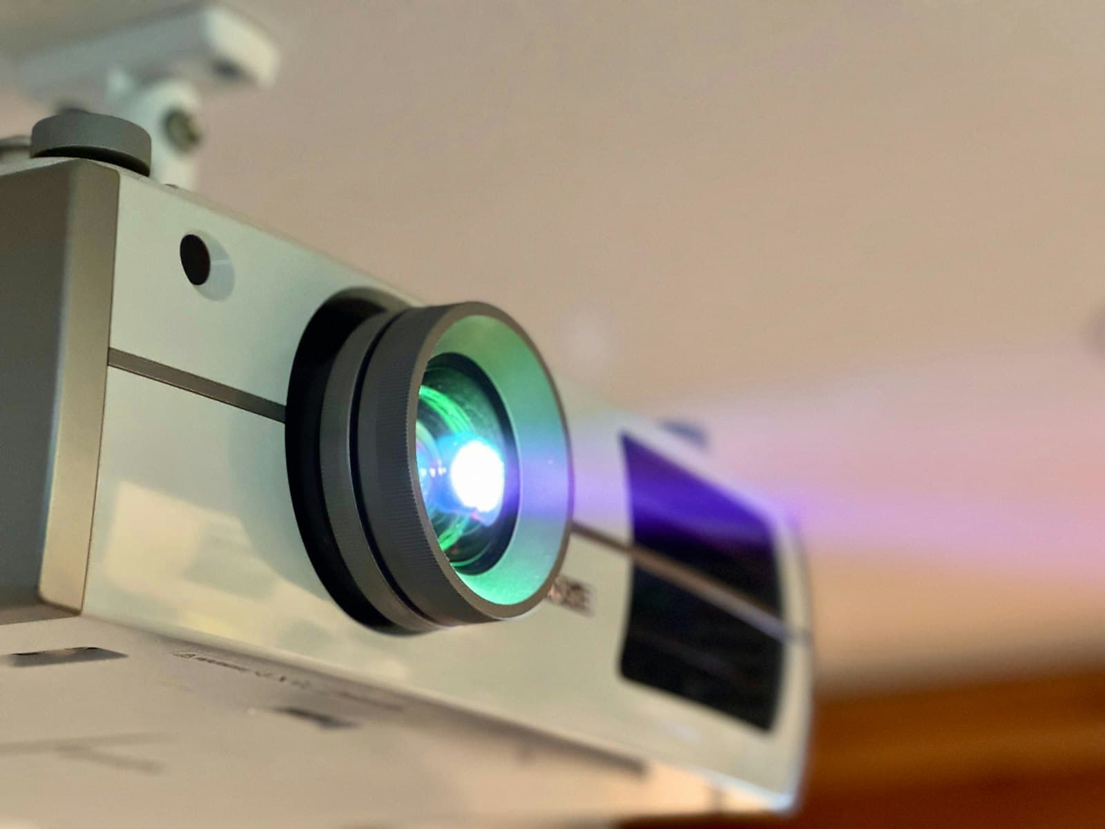 Aurea P500 projector at a three-quarter angle, dark grey housing